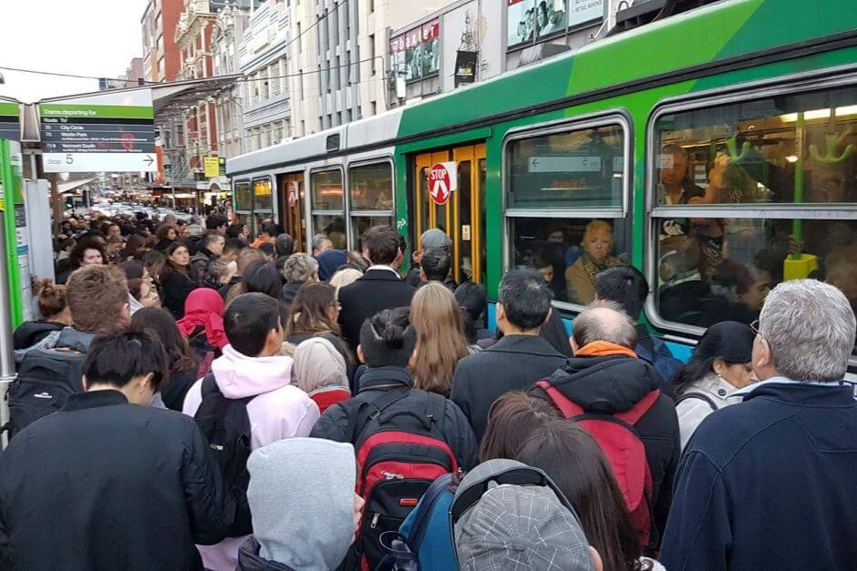 people waiting on tram