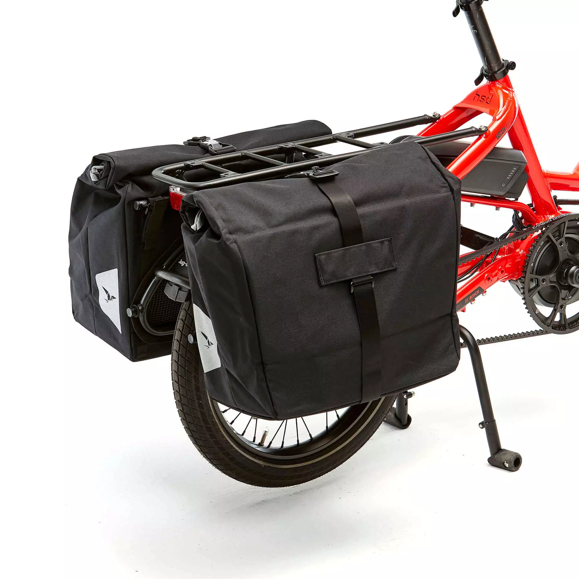 The Tern Cargo Hold 37 Panniers are a set of high-quality bike bags that provide ample storage space for your belongings during your cycling adventures. Designed to fit securely on your bike's rear rack, these panniers offer a combined capacity of 37 liters, making them ideal for longer trips or everyday commuting. With a rugged and water-resistant construction, these bags will protect your gear from the elements while on the road. Plus, they come with a variety of convenient features, including easy-access pockets, reflective details for added safety, and adjustable straps for a custom fit. Choose the Tern Cargo Hold 37 Panniers for a reliable and functional storage solution for your bike.